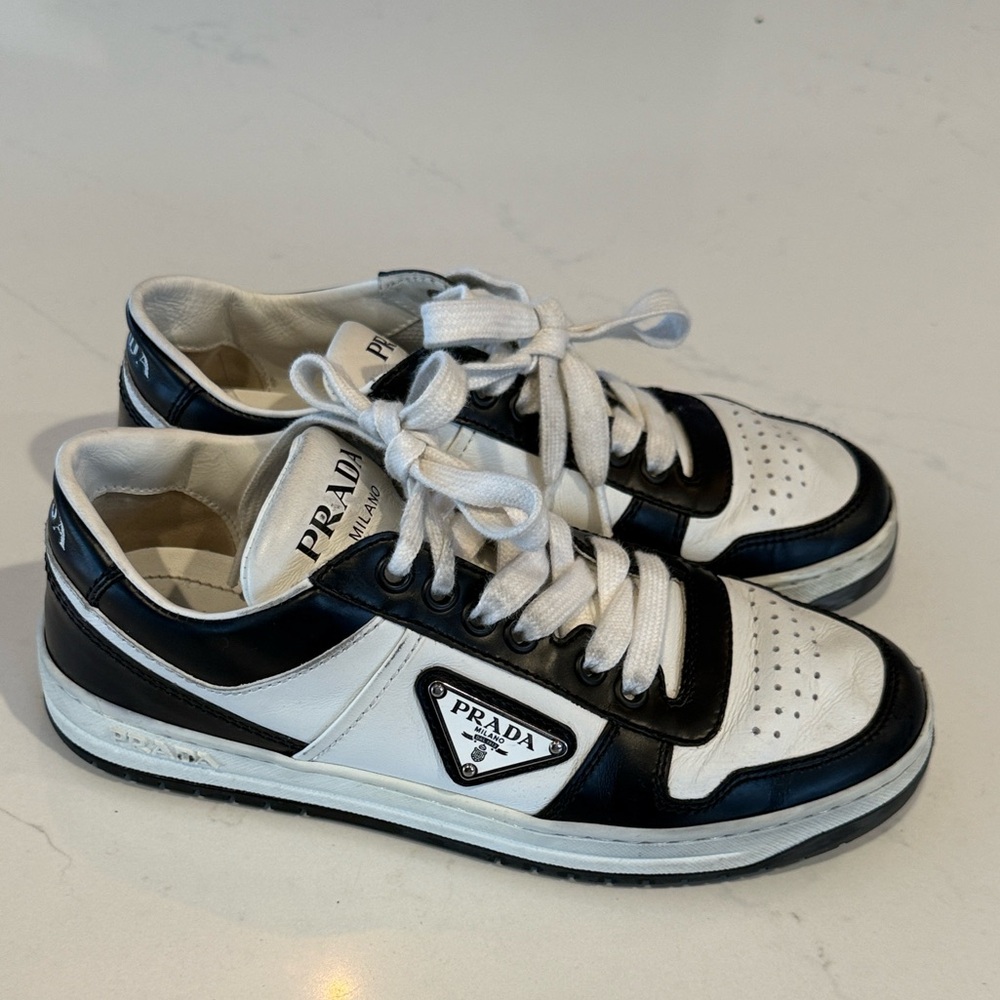 Authentic Prada Downtown perforated leather sneakers with signature enamel.